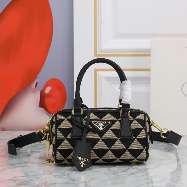 Symbole embroidered fabric top-handle bag