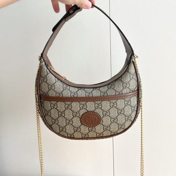 Half-moon-shaped mini bag with Interlocking G brown
